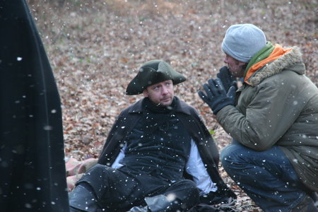 Sacha Bennett (director) and John Simm ('Gabriel') talk through a scene.