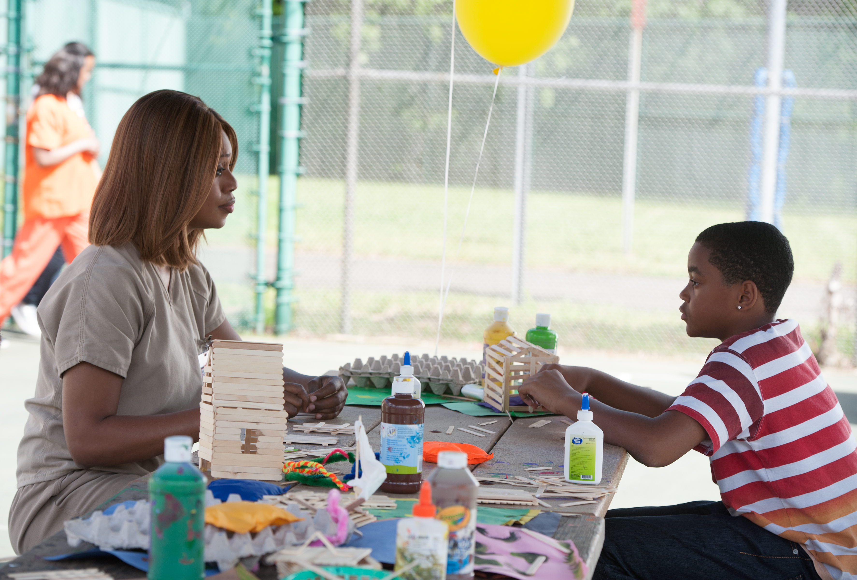 Still of Laverne Cox and Michael Rainey Jr. in Orange Is the New Black (2013)