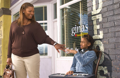 QUEEN LATIFAH and PAIGE HURD star as mother-daughter duo Gina and Vanessa in MGM Pictures' comedy BEAUTY SHOP.