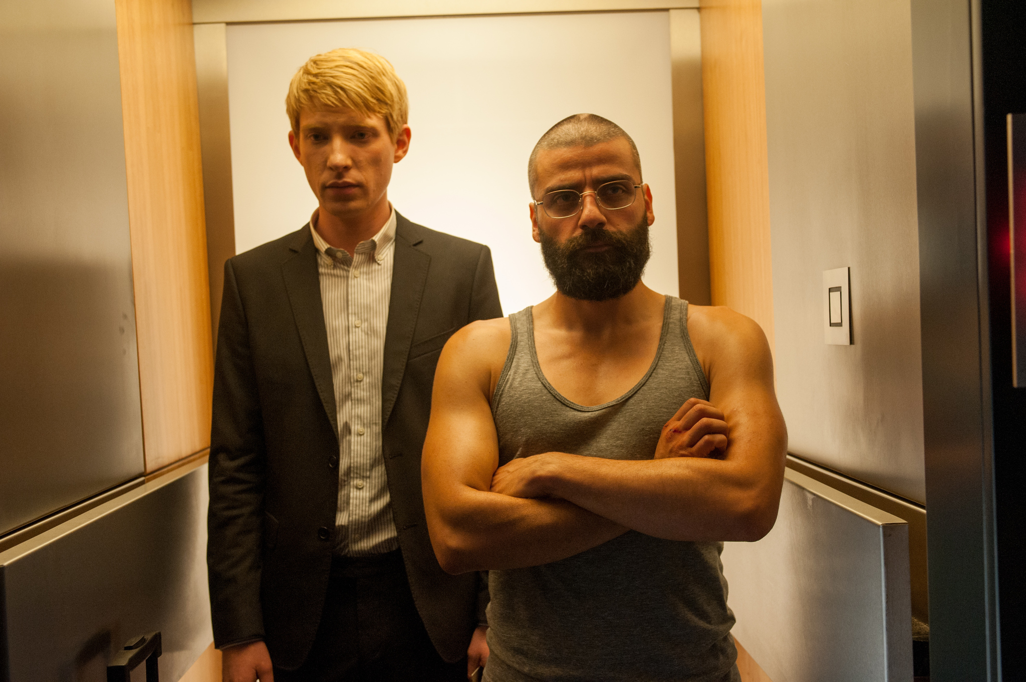 Still of Oscar Isaac and Domhnall Gleeson in Ex Machina (2015)