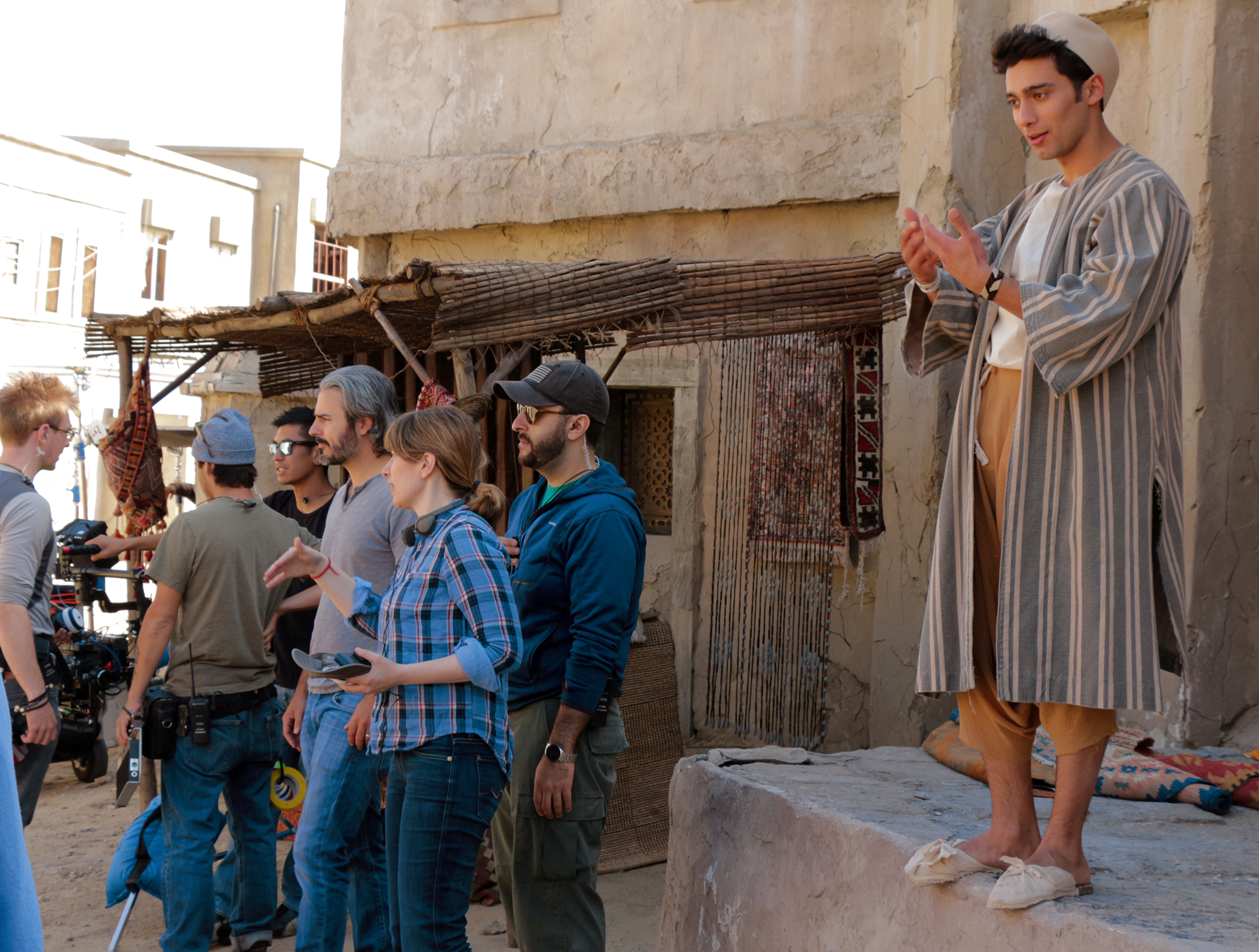 Amanda Tasse (center) directing an exterior crowd scene with DP Damian Horan (left), AD Kaveh Taherian (Right), and Actor Arash Marandi (Far Right).