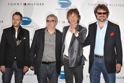 Director Stephen Kijak (L) singer Mick Jagger of the Rolling Stones (second right) and guests attend the 'Stones in Exile' Photo Call held at the Salon Martha Barriere at the Hotel Majestic during the 63rd Annual International Cannes Film Festival on May 19, 2010 in Cannes, France.