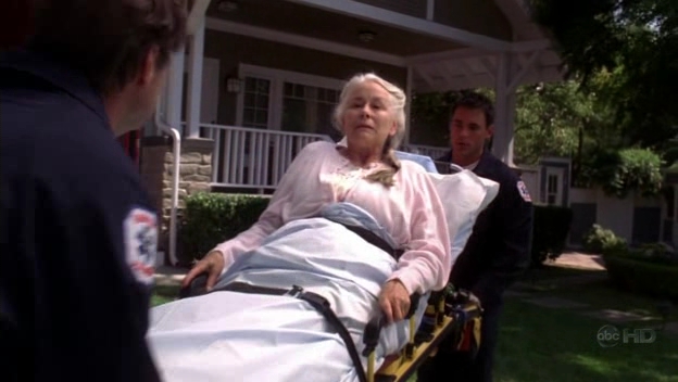 George Watson as Aunt Lily's stretcher attendant (left) on Desperate Housewives Starring Terrry Hatcher, Eva Longoria Parker, Marcia Cross, Dana Delany, Kyle MacLachlan, Nathan Fillion