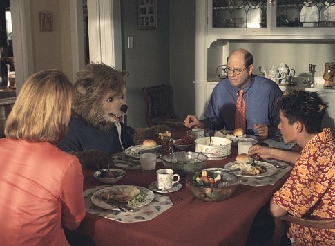 Beary (center left) breaks bread with his overbearing family - his mother (Meagen Fay, left), father (Stephen Tobolowsky, center right), and brother, Dex (Eli Marienthal, right).