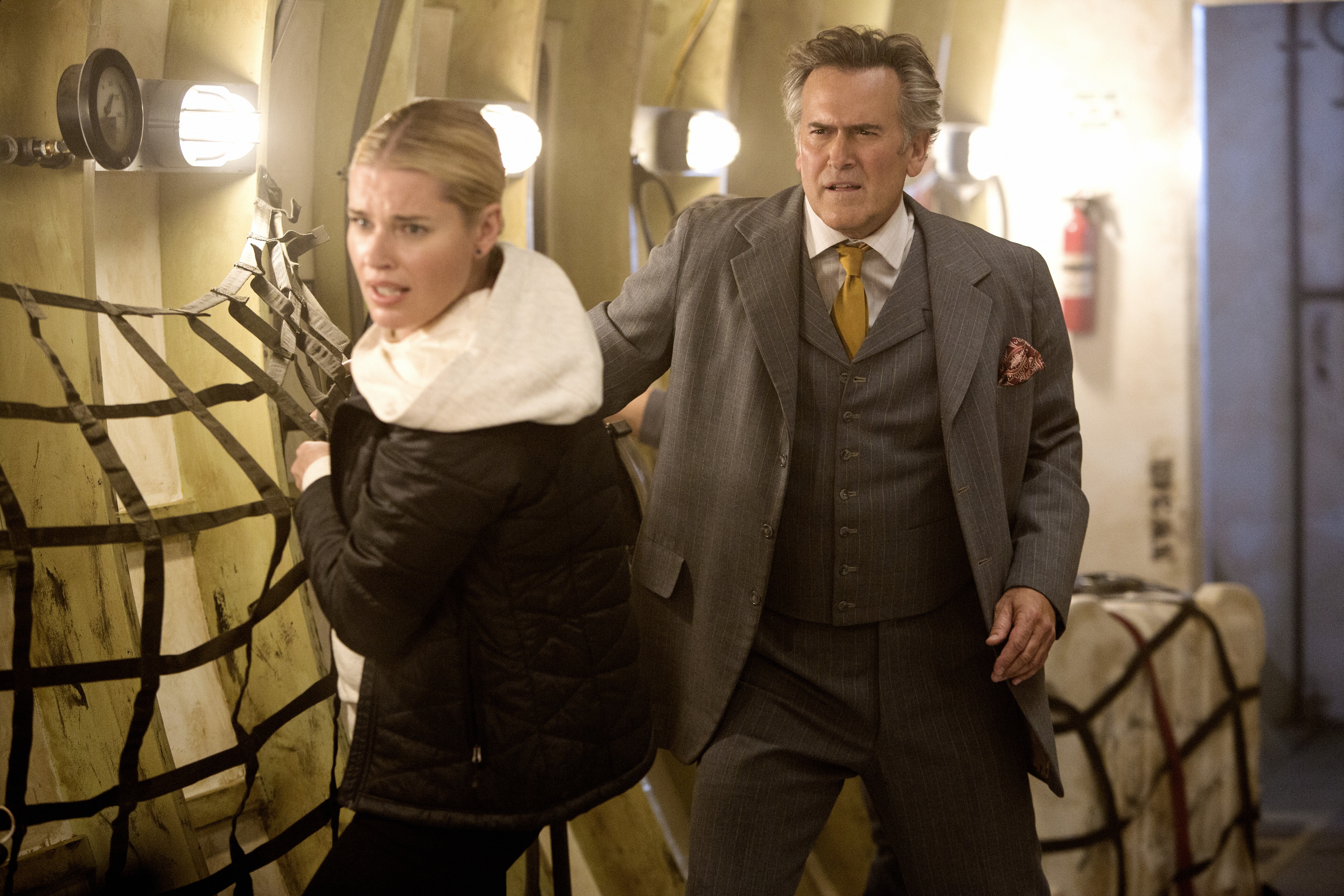 Still of Rebecca Romijn and Bruce Campbell in The Librarians (2014)