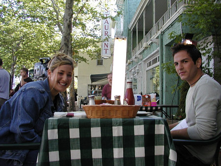 Jane Rumsfield (Natalie Durante) and Steve Wilson (Pete Capella) share a lunch in a scene from Never Among Friends (2002)