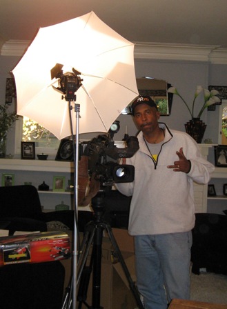 David-Michael Madigan's favorite camera man, Rodney, prepares the lighting for the next take of D-M's design segment.