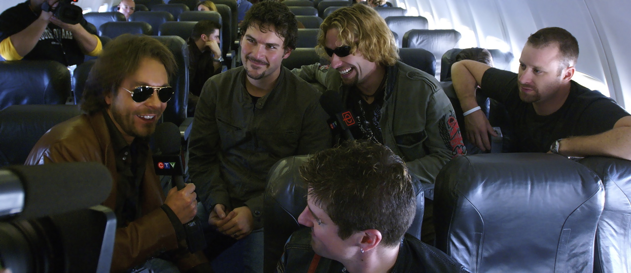 NICKELBACK WORLD TOUR: (left to right) David Giammarco, Ryan Peake, Chad Kroeger, Mike Kroeger, and Daniel Adair at 37,000 feet.