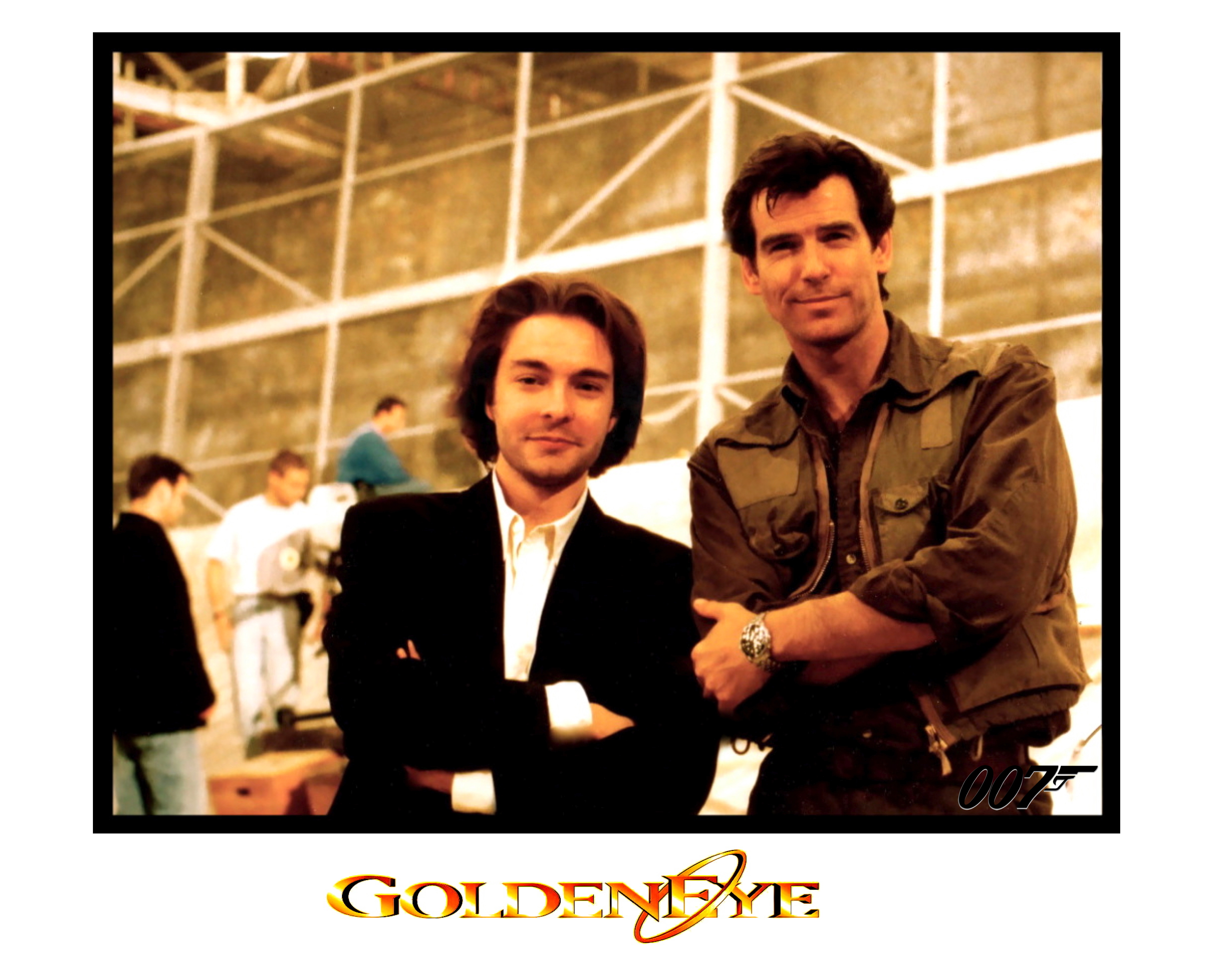 PIERCE BROSNAN and DAVID GIAMMARCO during filming of 