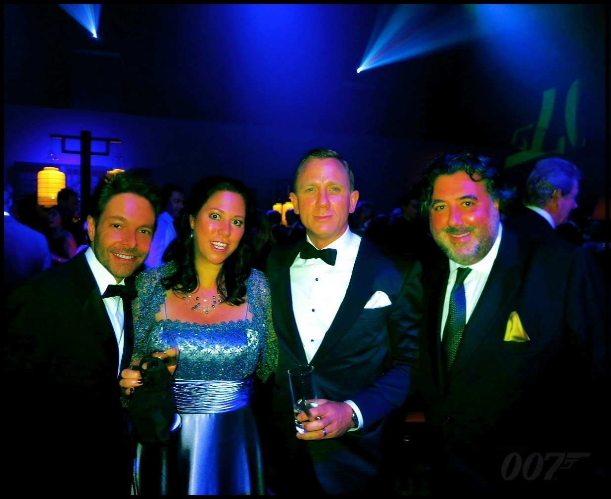 Caption: David Giammarco and Daniel Craig, with Hilary Saltzman and Steven Saltzman photographed together for the Royal World Premiere of the 50th Anniversary James Bond film 