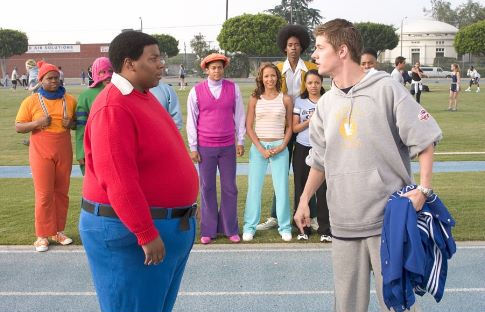 Arthur (J. Mack Slaughter, Jr. right) confronts Fat Albert (Kenan Thompson) on the track. Observing in the background are (L-R) Mushmouth (Jermaine Williams), Dumb Donald (Marques B. Houston), Rudy (Shedrack Anderson III), Lauri (Dania Ramirez), Old Weird Harold (Aaron A. Frazier), Doris (Kyla Pratt) and Bucky (Alphonso McAuley).