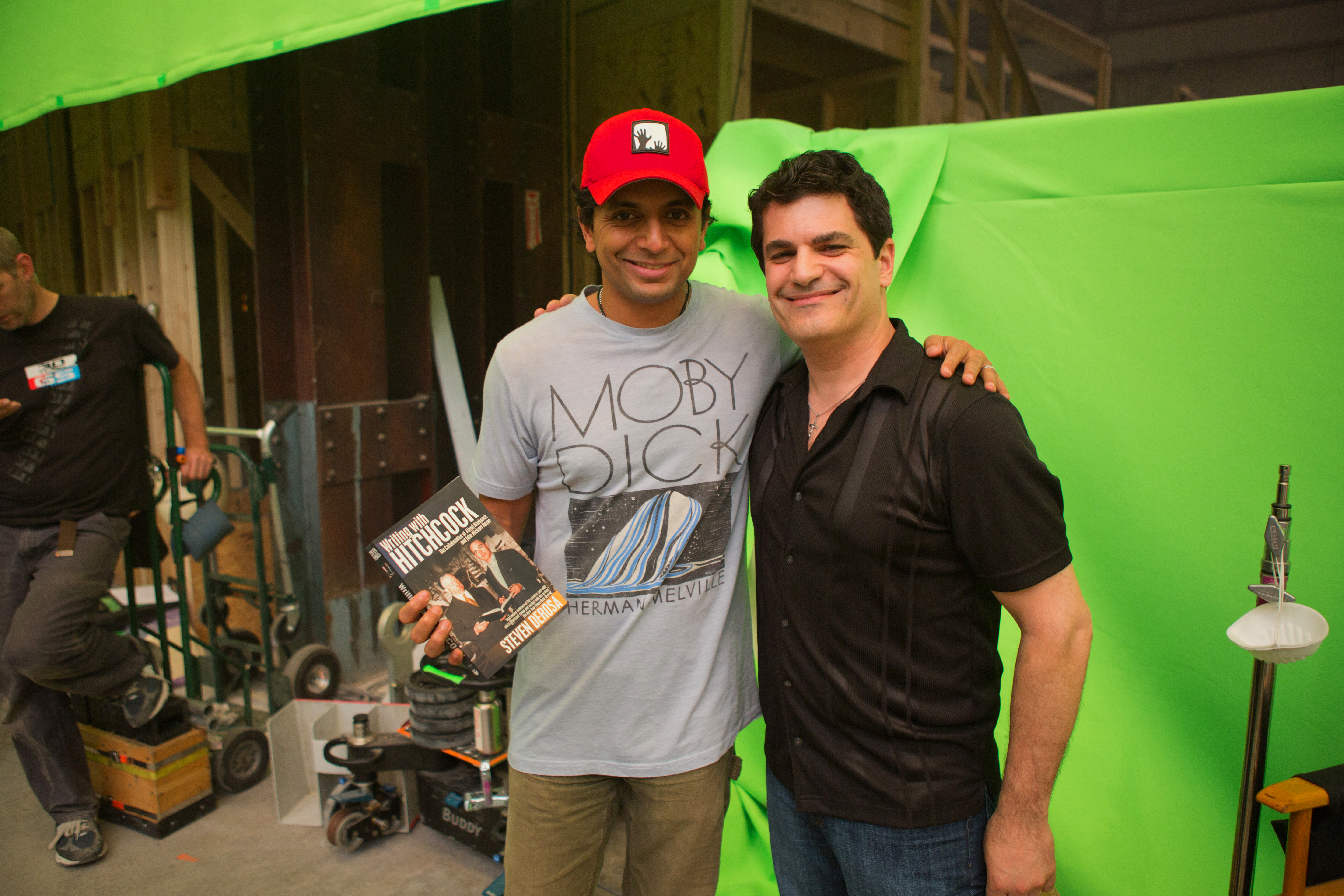 Writer/director M. Night Shyamalan welcomes author Steven DeRosa to the set of 