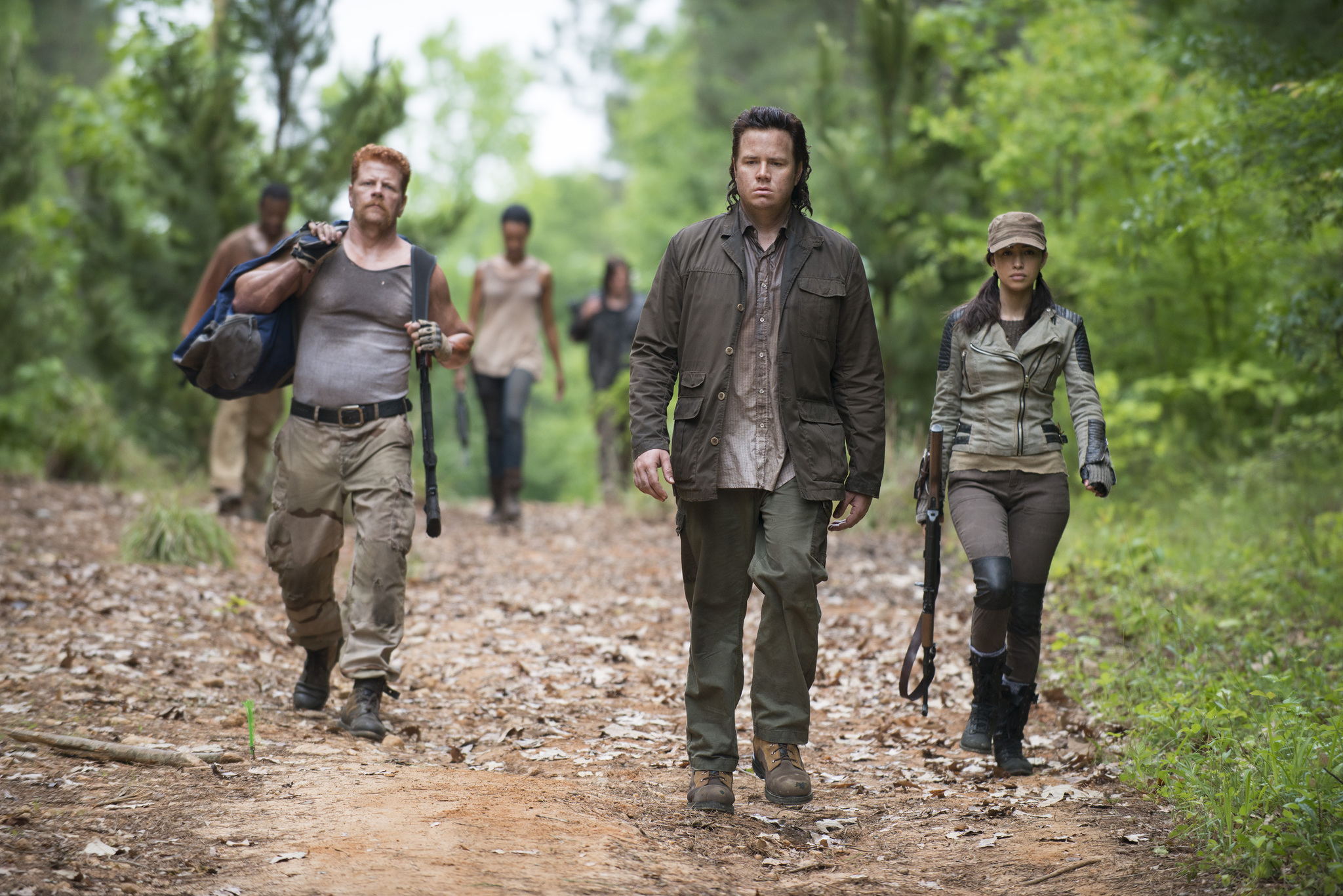 Still of Michael Cudlitz, Christian Serratos and Josh McDermitt in Vaiksciojantys negyveliai (2010)