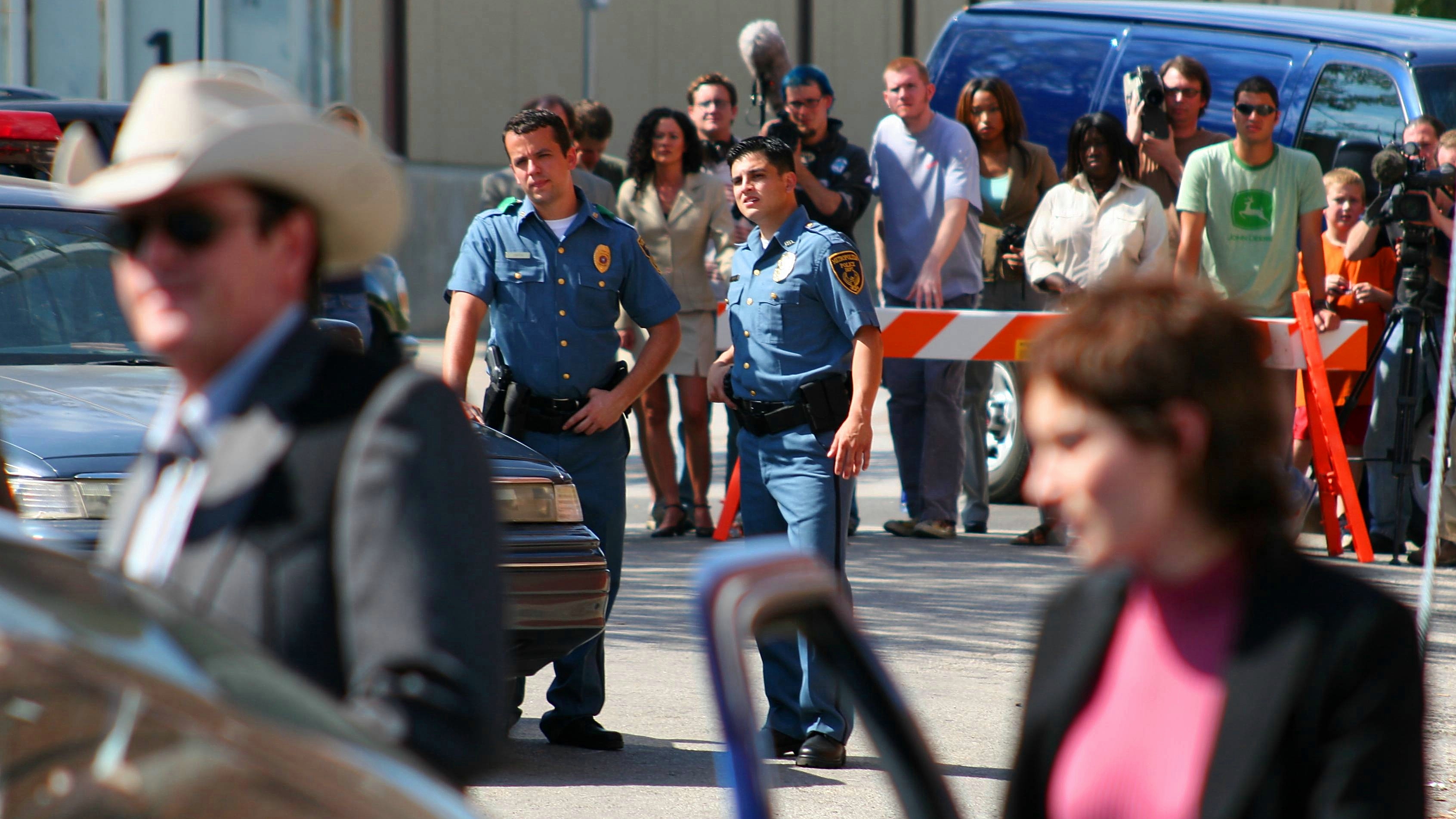 Todd Jenkins pictured as the police officer on the left in the movie Living & Dying.