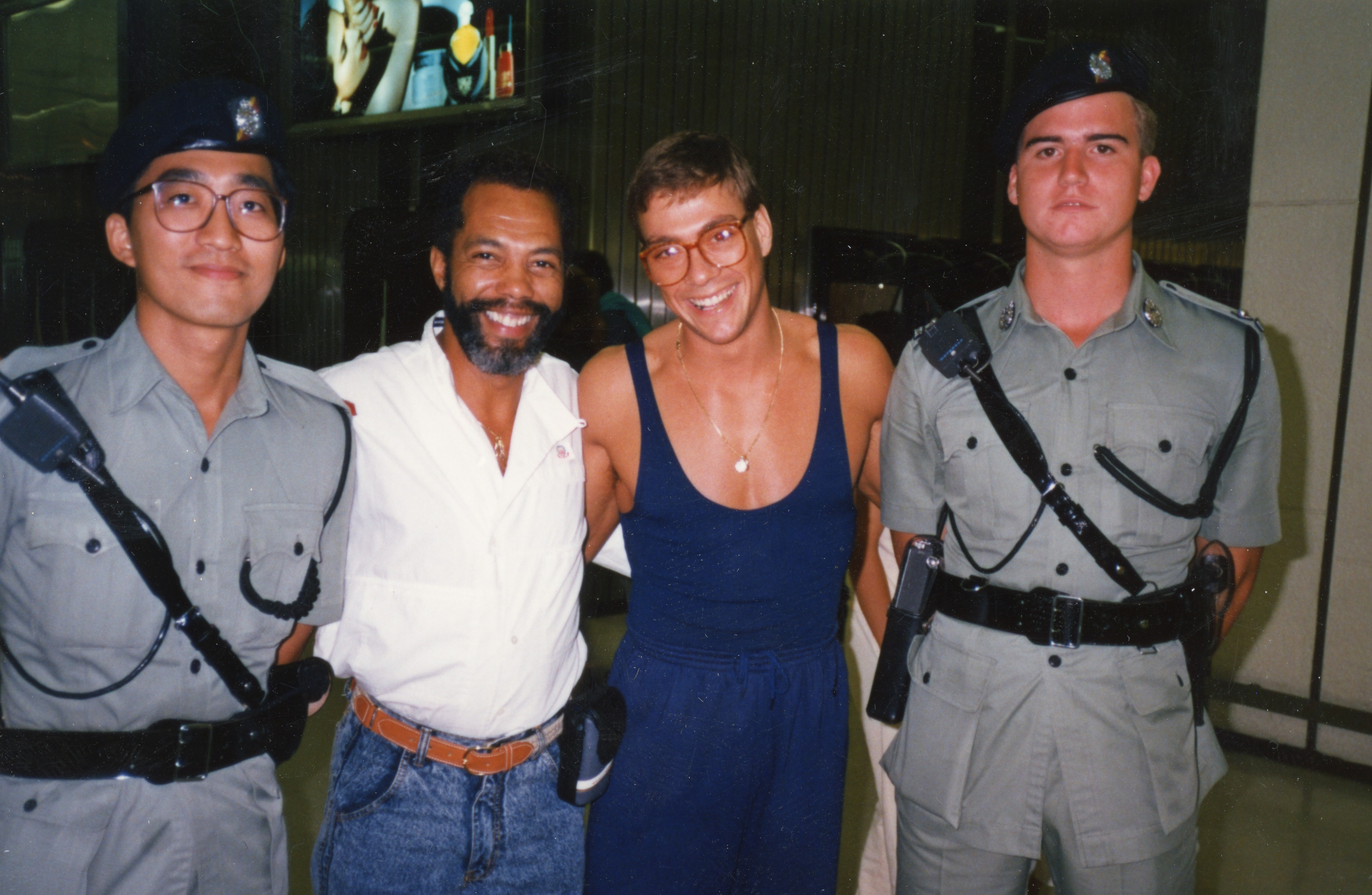 Jean Claude Van Damm and Haskell Vaughn Anderson III with 2 Hong Kong Police Officers after filming in Hong Kong of 'KICKBOXER'