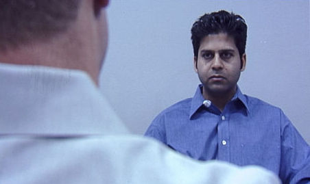 Deashish Saxena as Javed, at his INS hearing