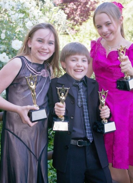 Alix Kermes, Luke Spill, and Madison Ford hold their trophies from the 2005 26th Annual Young Artist Awards