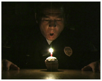 Sgt. John Holloway alone on his birthday begins the short feature COPZONE directed by Shawn Flanagan.
