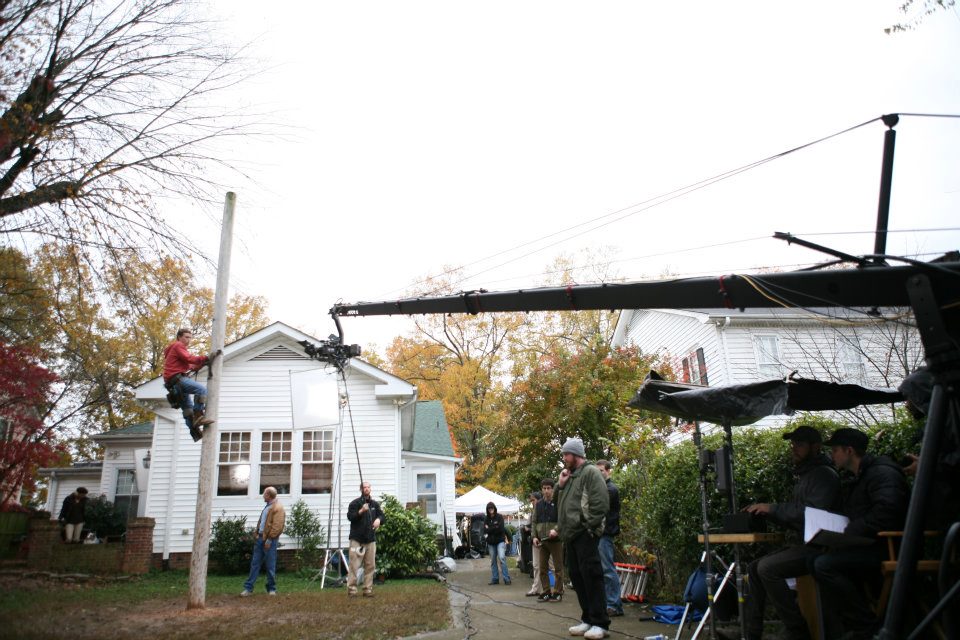 Mark Freiburger and cinematographer Rob Givens (on right) with actors Ted Levine and Ian Colletti (in background) on the set of 