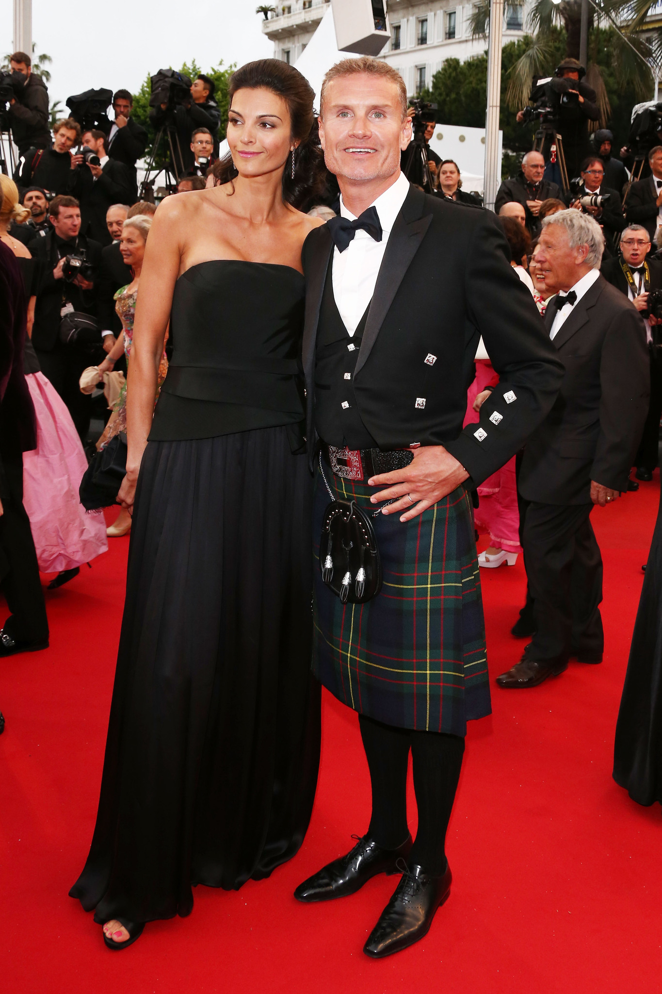 Former Formula 1 driver David Coulthard (R) and Karen Minier attend 'Weekend Of A Champion' Premiere during the 66th Annual Cannes Film Festival at Palais des Festivals on May 22, 2013 in Cannes, France.