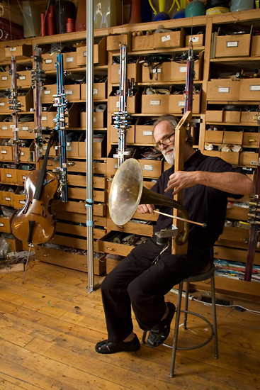 Artist/inventor/composer Trimpin plays an instrument of his own design.
