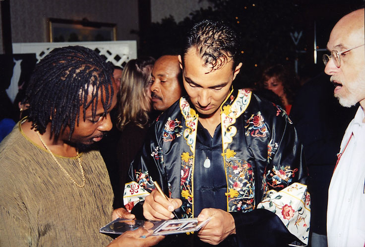 Vincent signing CD's at the Release Party. To the right the international award winning writer Edwin Morris.
