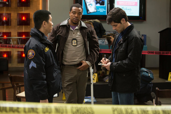 Still of Reggie Lee and David Giuntoli in Grimm (2011)