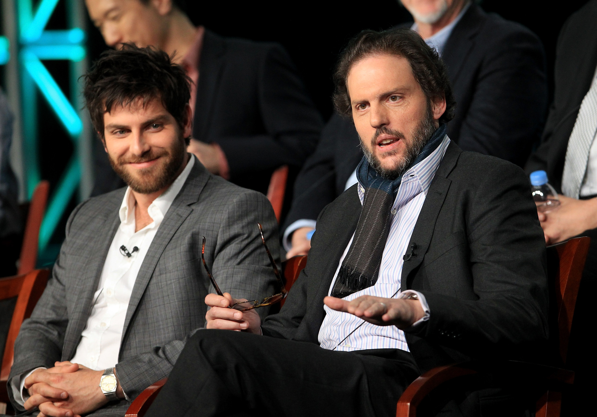 David Giuntoli and Silas Weir Mitchell speak onstage at the 