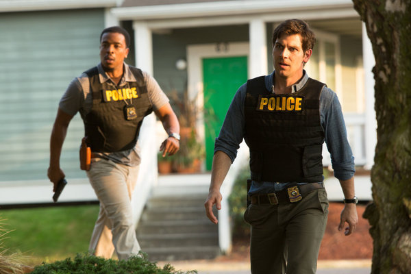 Still of Russell Hornsby and David Giuntoli in Grimm (2011)