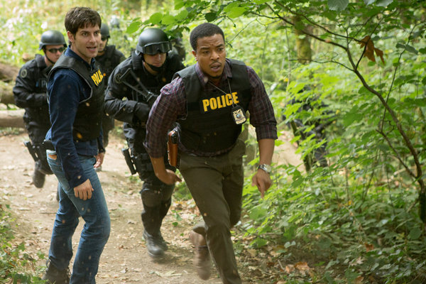 Still of Russell Hornsby and David Giuntoli in Grimm (2011)