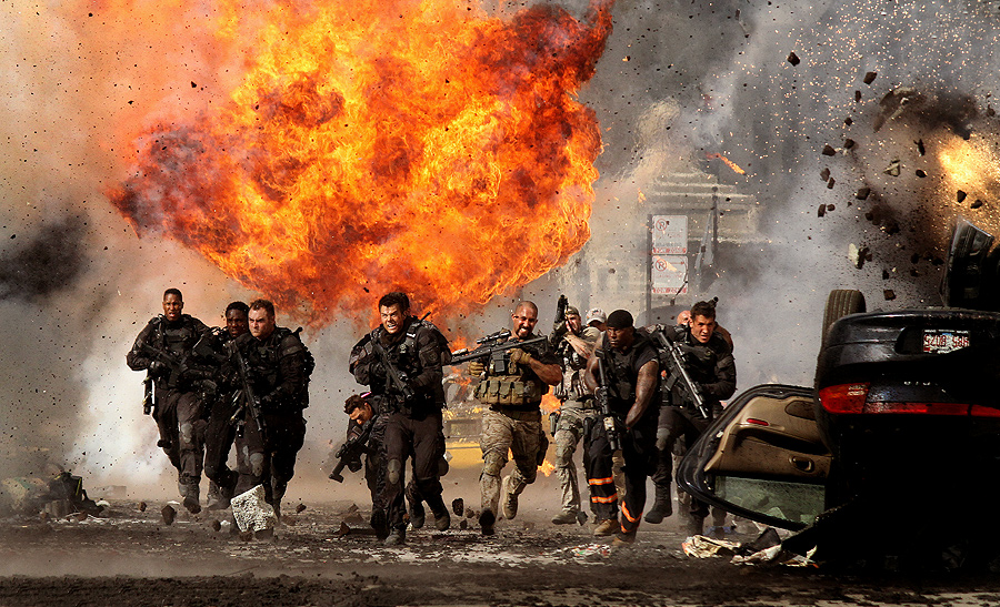 James Weston II far left-Josh Duhamel center- Tyrese Gibson 2nd from right running thru series of explosions during Transformers:Dark of the Moon