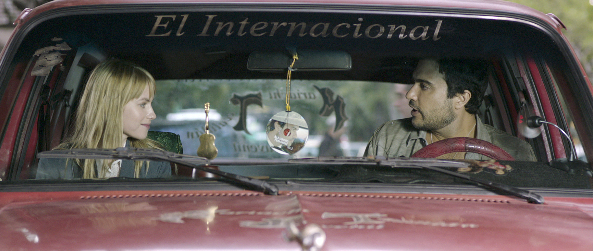 Still of Jaime Camil and Laura Ramsey in Pulling Strings (2013)
