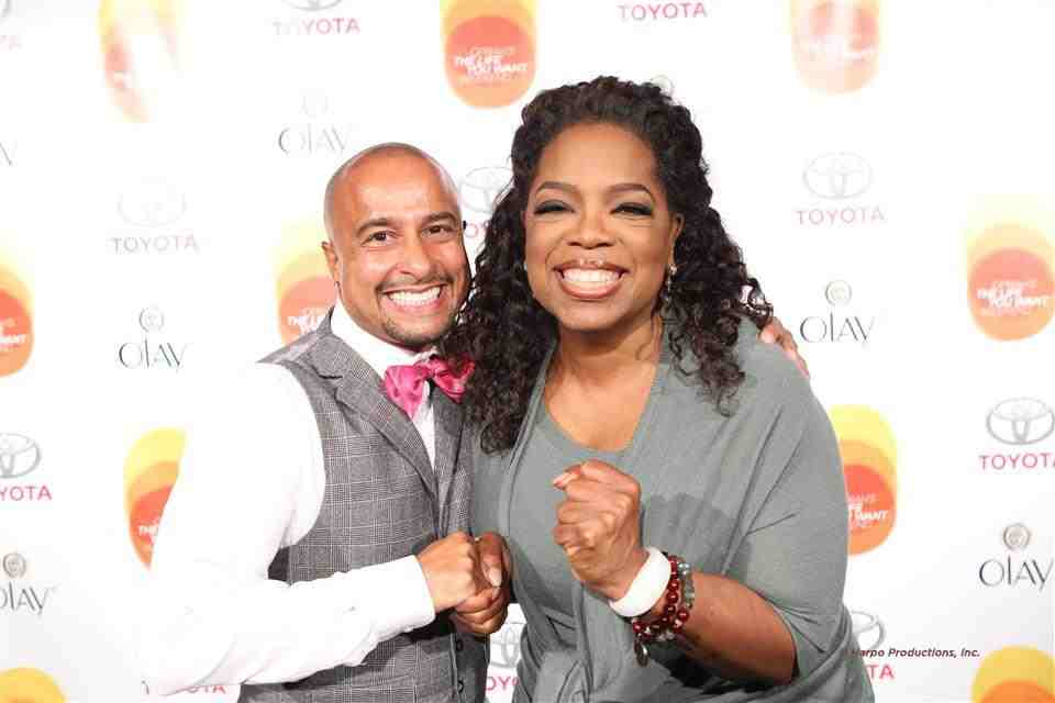 TV/Film choreographer Chuck Maldonado and Oprah Winfrey sharing a happy moment on the Red Carpet