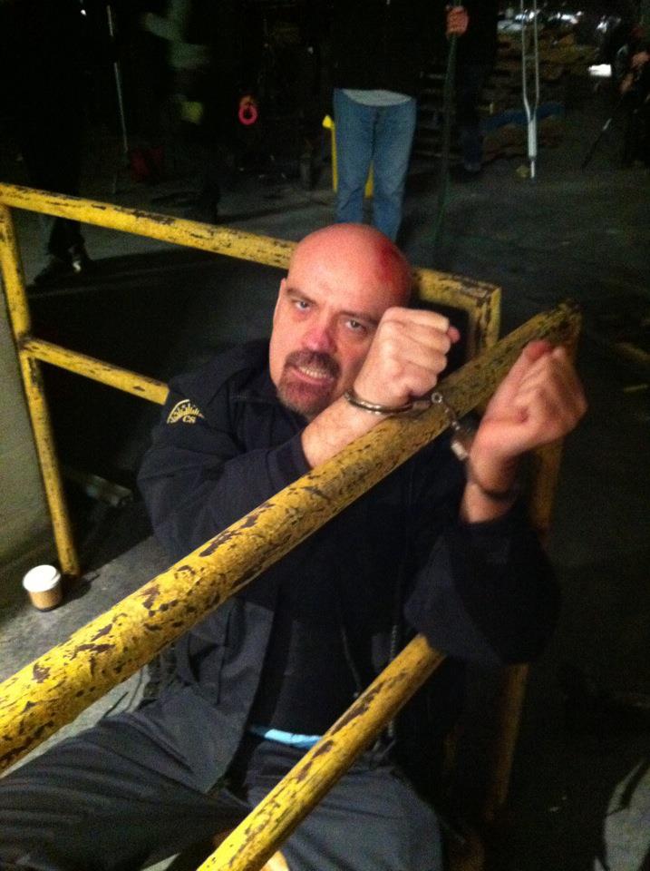 Warehouse 13 - Season 4, Episode 403 James Collins (Armored Truck Driver) hancuffed to a pole