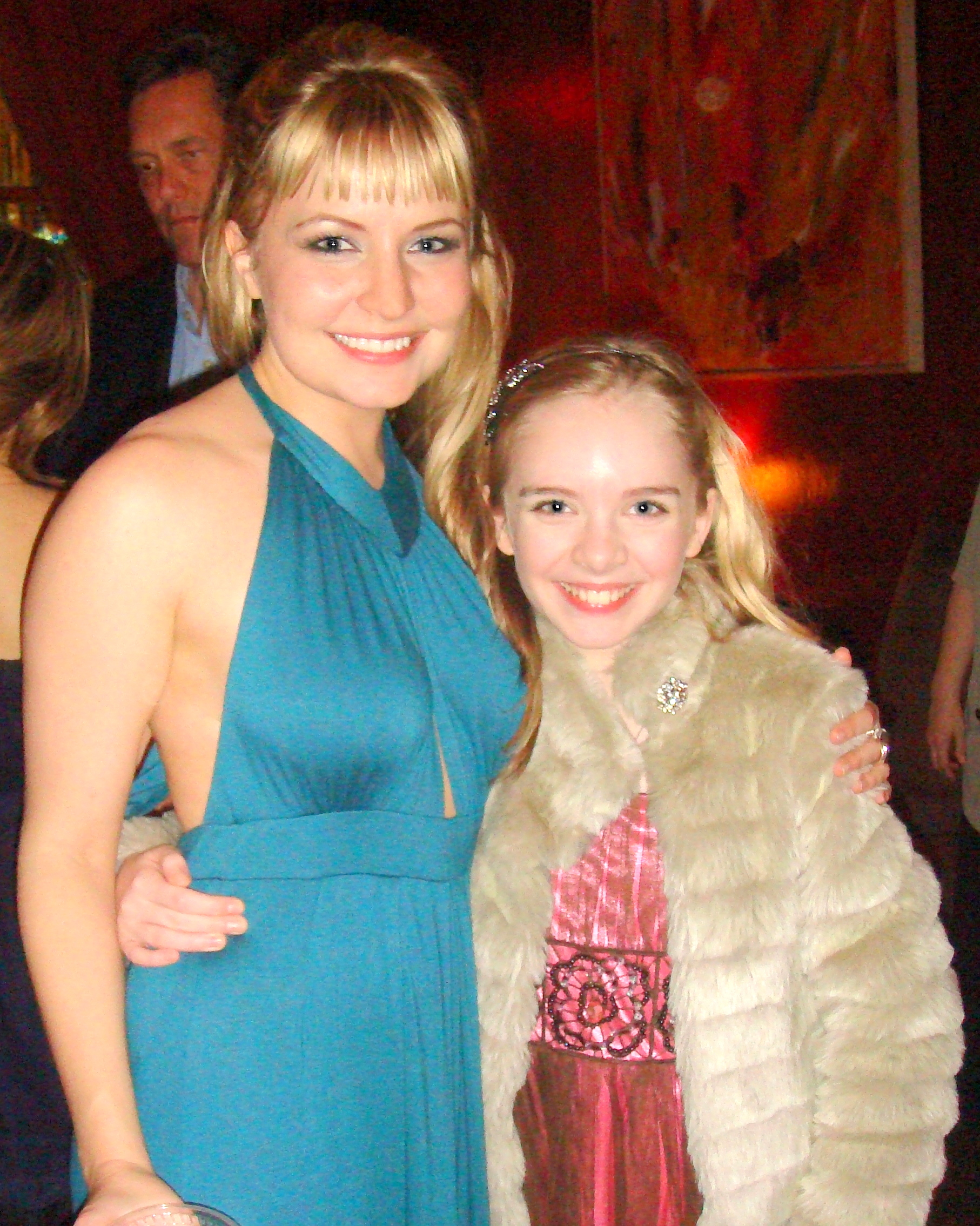 Lindsey Haun (Emily)and Darcy Rose Byrnes (Young Emily) after the opening of EMILY'S SONG at the Hudson Backstage Theatre with writer/director Chet Holmes behind.