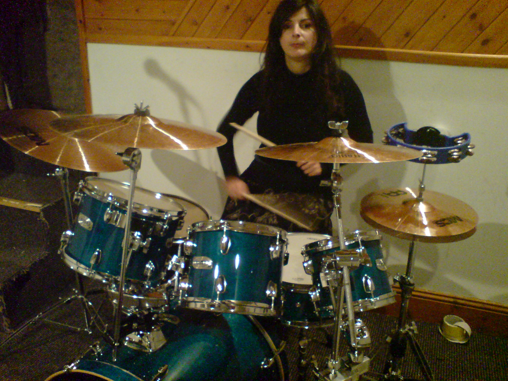 Francesca drumming in her studio.