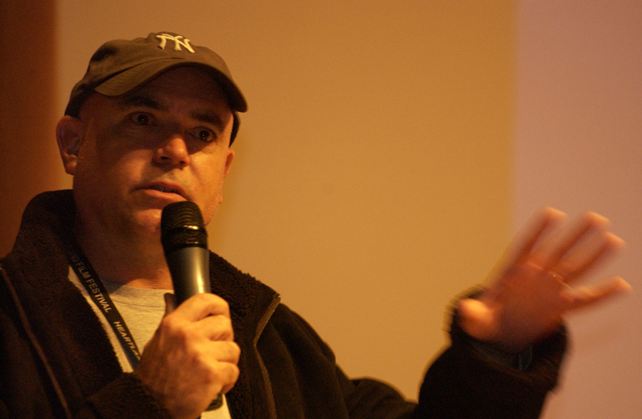 Schroeder answering questions at a Q & A after a MAN IN THE CHAIR screening.