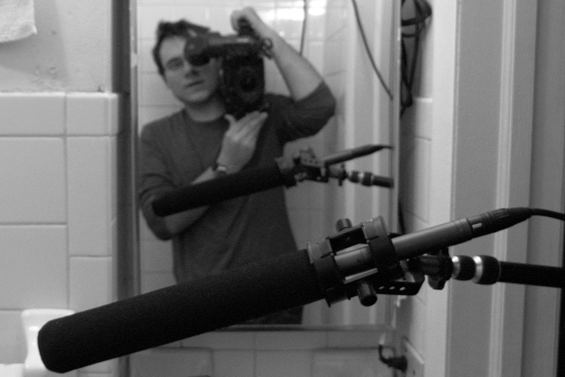 Director Carlos Ferrer captures himself through a mirror while shooting a scene from Retina.