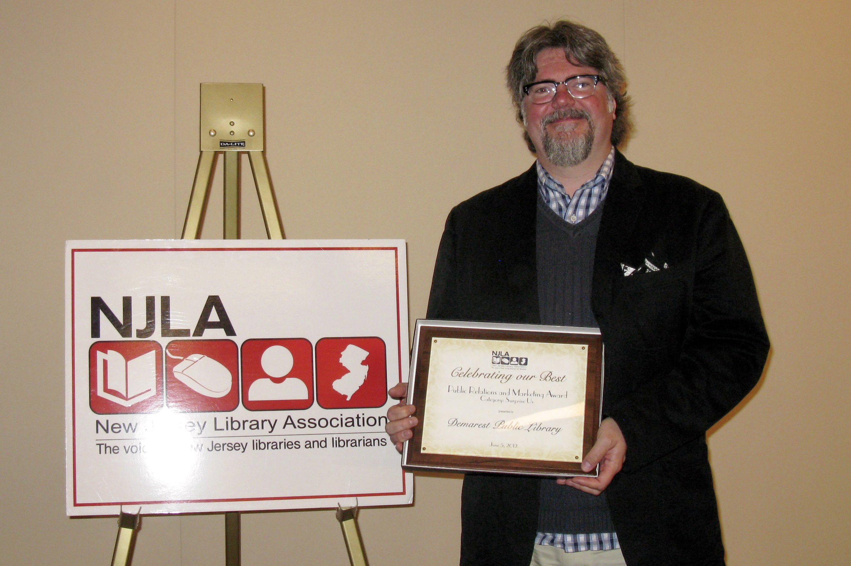 Steven Jon Whritner accepting an award from the NJ Library Association (June 5, 2012).