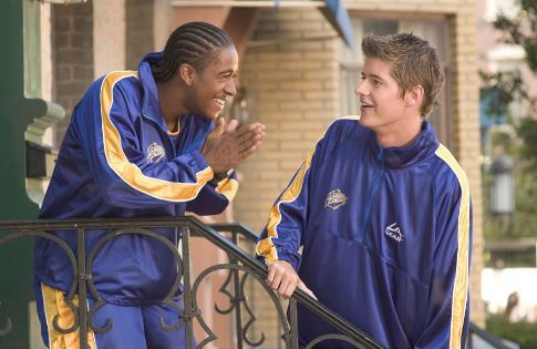 Reggie (Omari Grandberry, left) and Arthur (J. Mack Slaughter, Jr.) plot against their rivals, Fat Albert and the Cosby Kids.