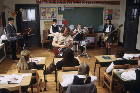 (Center) Jack Black as Dewey, (kids back row, left to right) Robert Tsai as Lawrence, Joey Gaydos Jr. as Zack, Kevin Clark as Freddy and Rebecca Brown as Katie