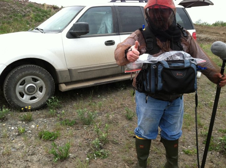 Herd Hat, Mosquito Net, Rain gear and Mud boots. Whatever it takes!