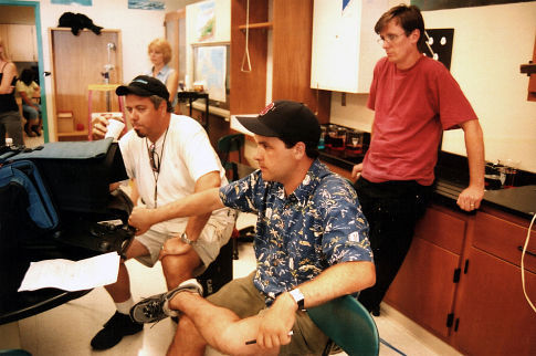 Gaffer Mike J. Walsh, Director Paul Sullivan and Art Director Michael Shindler observe a rehearsal.