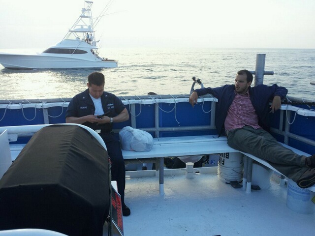 End of a day BTS of CAPTAIN PHILLIPS. Omar Berdouni and I relax as our water taxi takes is back to shore.