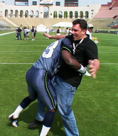 Los Angeles Memorial Coliseum getting tackled by a Seattle Seahawk for Upper Deck Football Cards