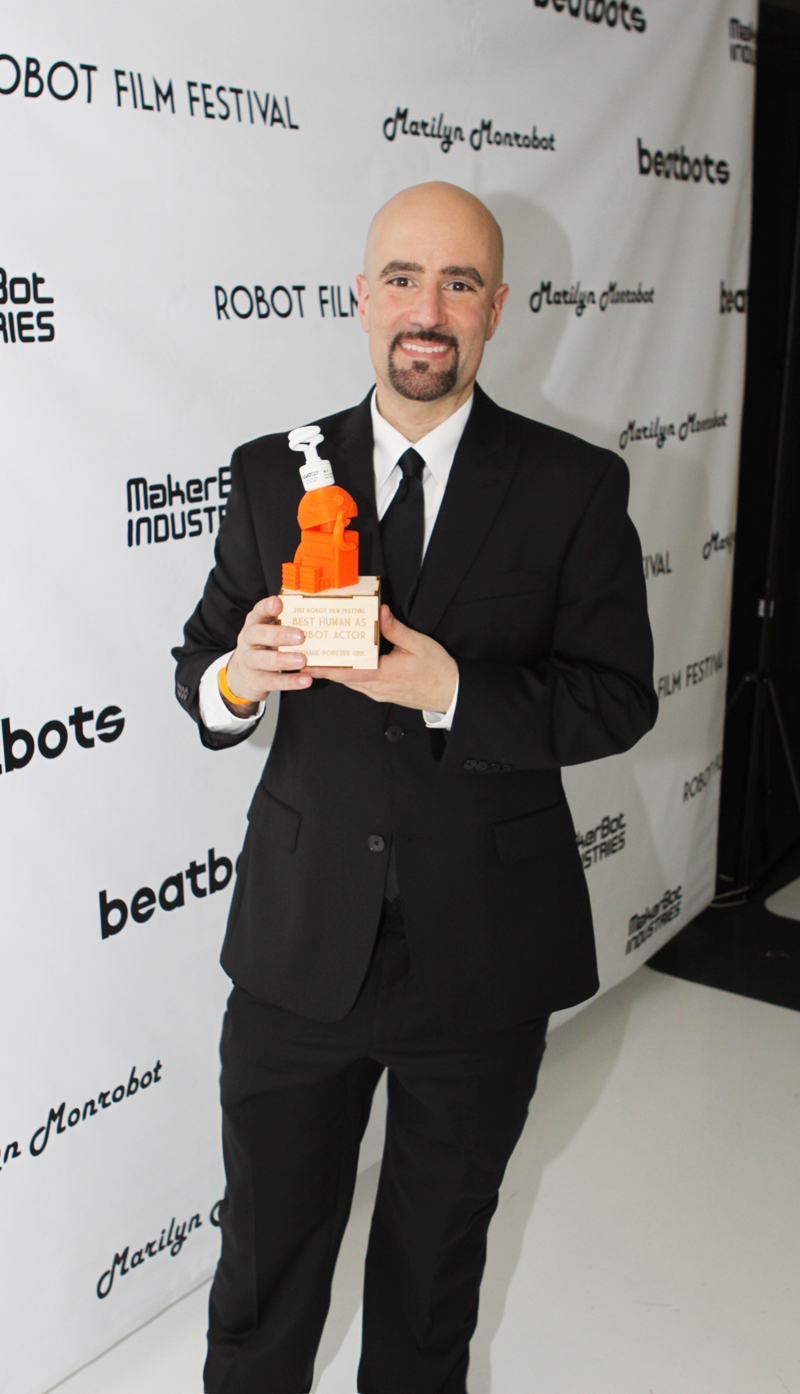 Director Daniel Azarian holds a 2012 Botsker Award for 