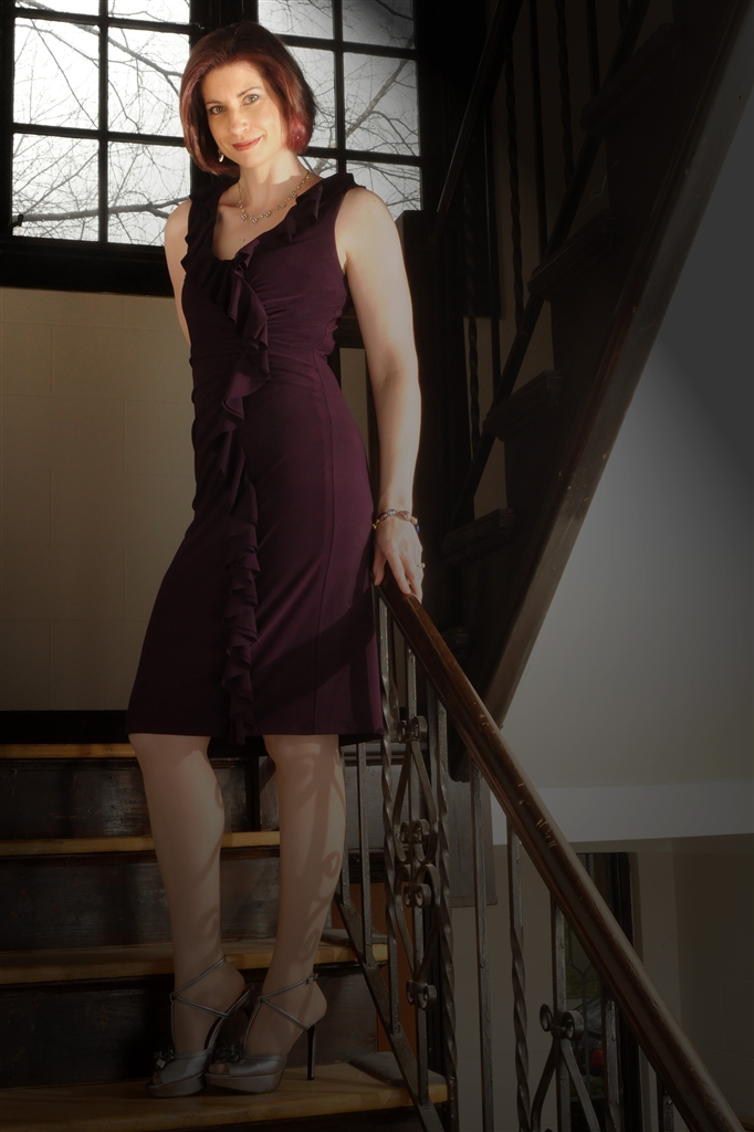Full-length in violet dress.
