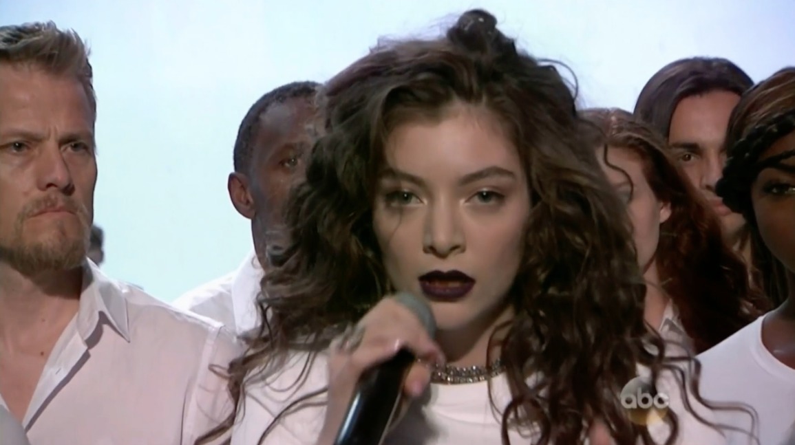 Still of Trevor Snarr and Lorde in her performance of 