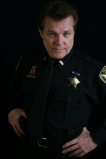 Dennis as a cop