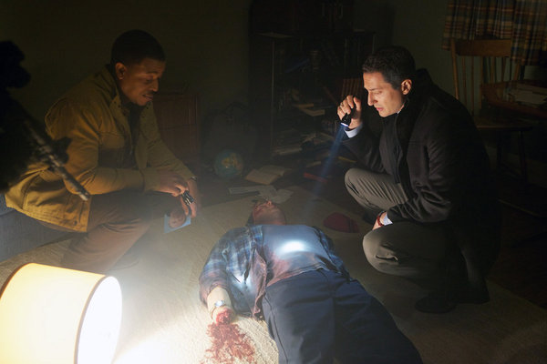 Still of Russell Hornsby and Sasha Roiz in Grimm (2011)